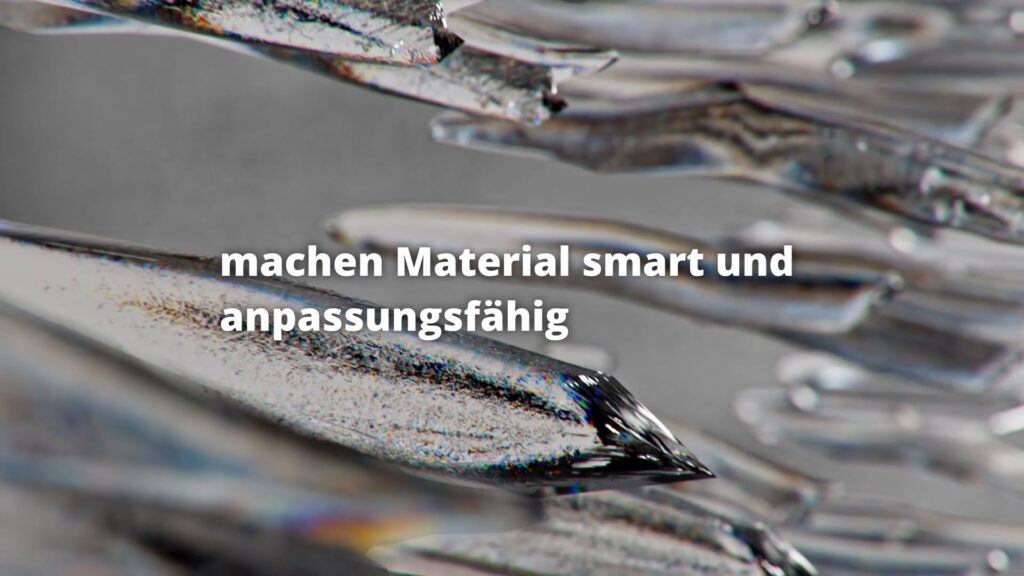 Metallische Oberfläche in Nahaufnahme mit Texteinblendung zu smarten, anpassungsfähigen Materialien
